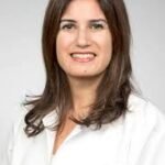 Dr. Nadine Koser